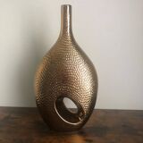 Golden ceramic vase.