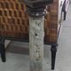 Column-shaped pedestal, made of solid wood and faux marble paint.