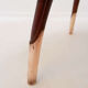 Round Art Deco side table in wood with curved legs and brass feet.