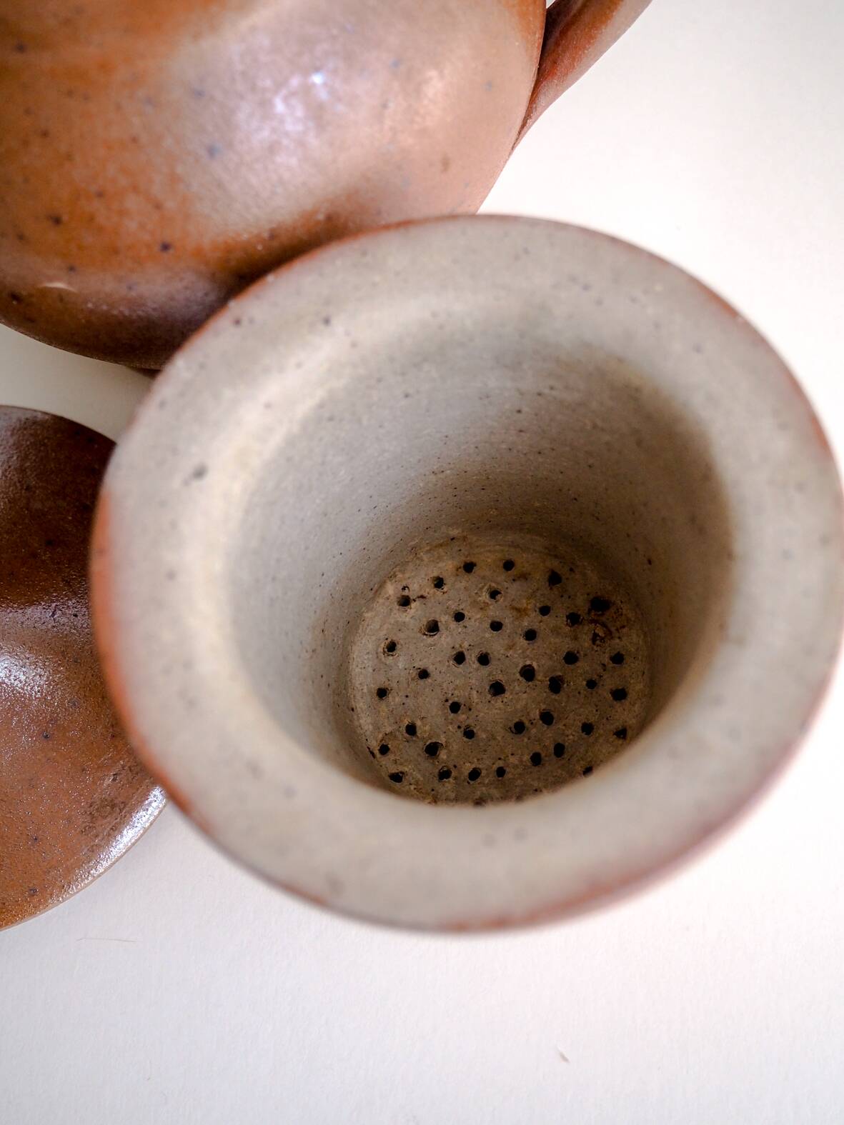 Handcrafted stoneware teapot with strainer
