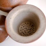 Handcrafted stoneware teapot with strainer