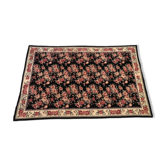 Carpet at the small dot decorated with roses on a black background, late nineteenth