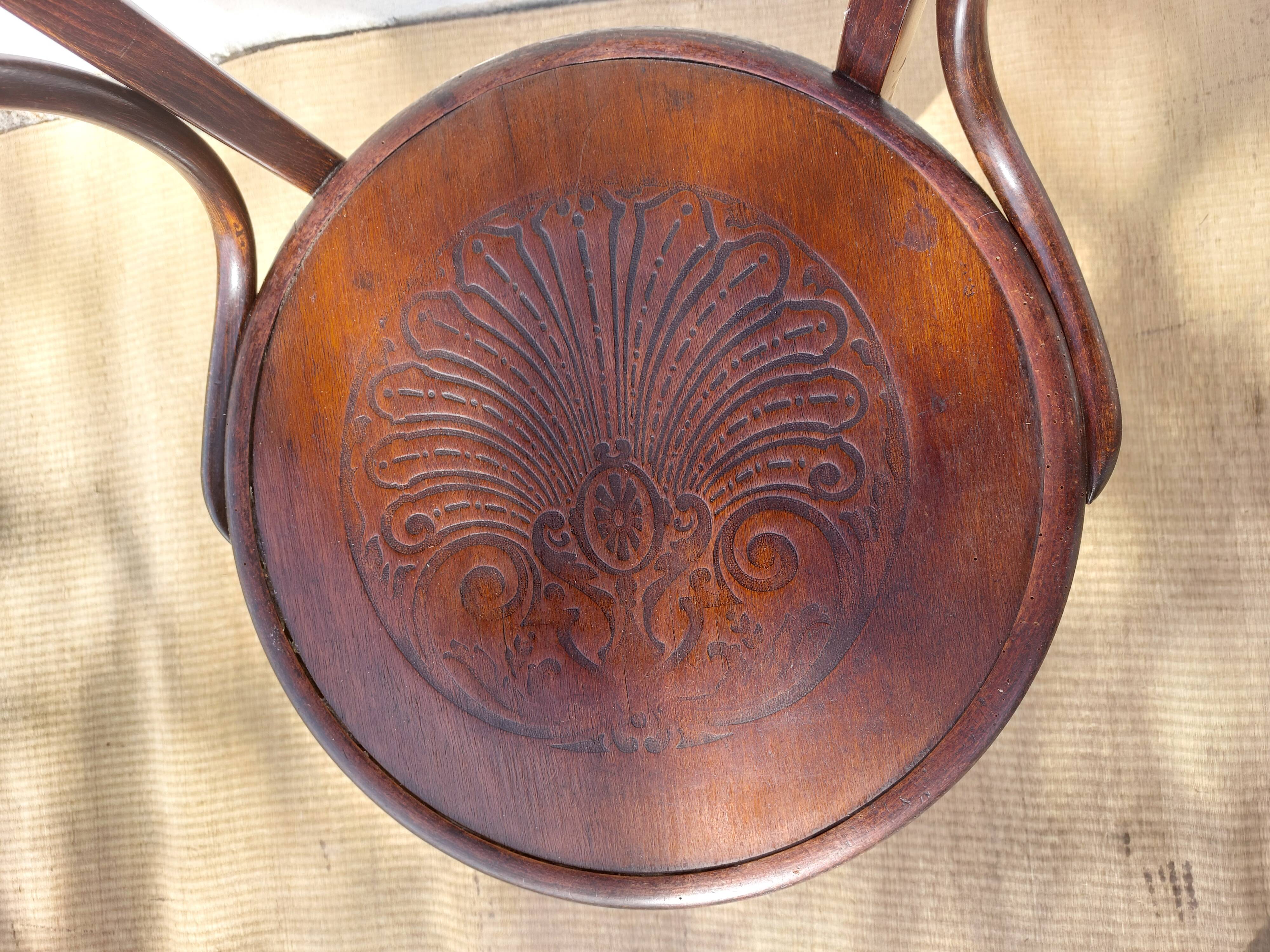 Swivel wooden armchair, pattern on seat