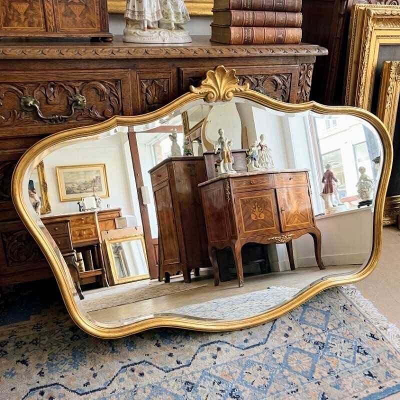 Louis-Philippe gilded mirror with shell pediment