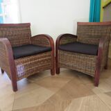 2 colonial-style armchairs in woven rattan and exotic wood