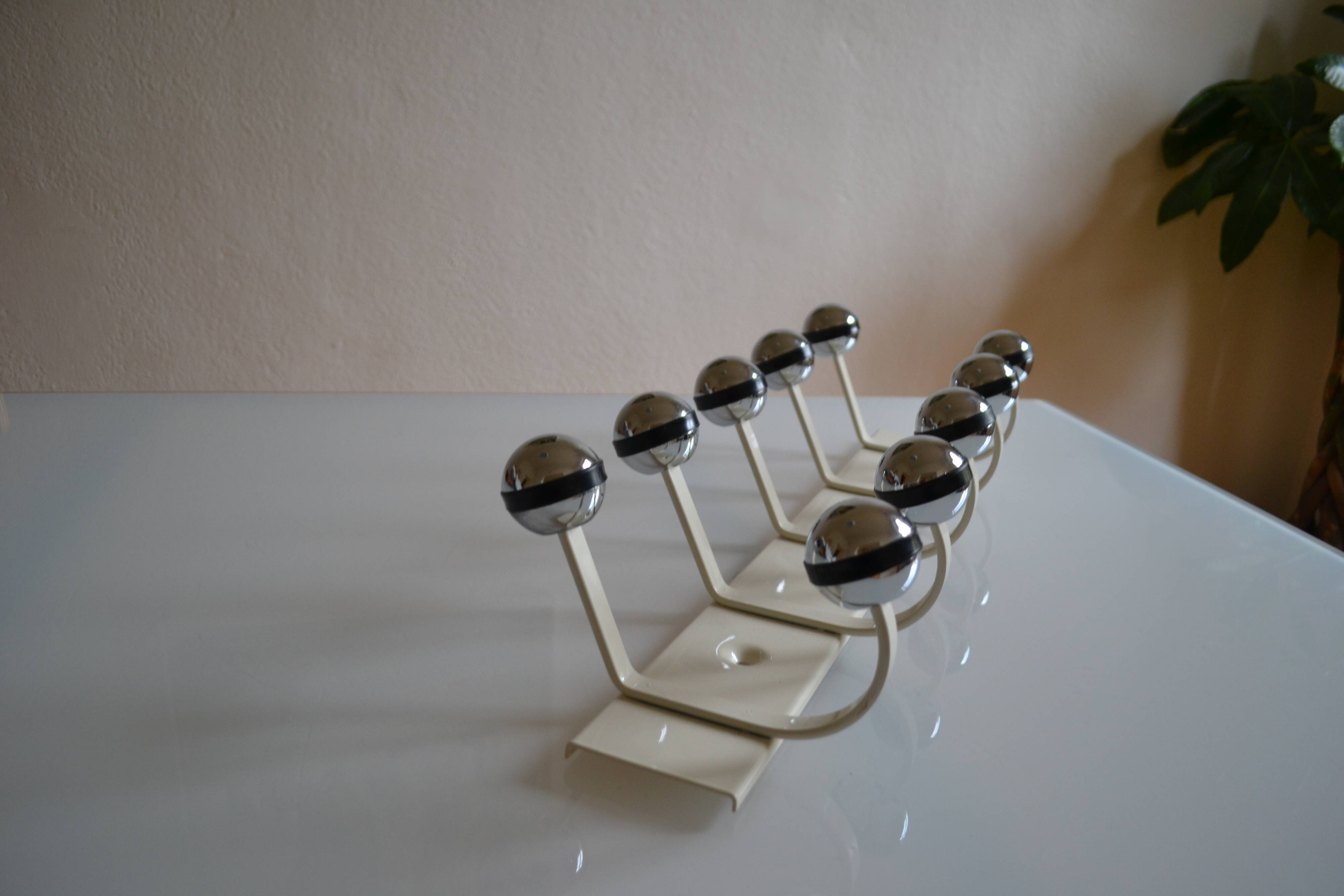 Vintage 1970s wall-mounted coat rack with 10 hooks