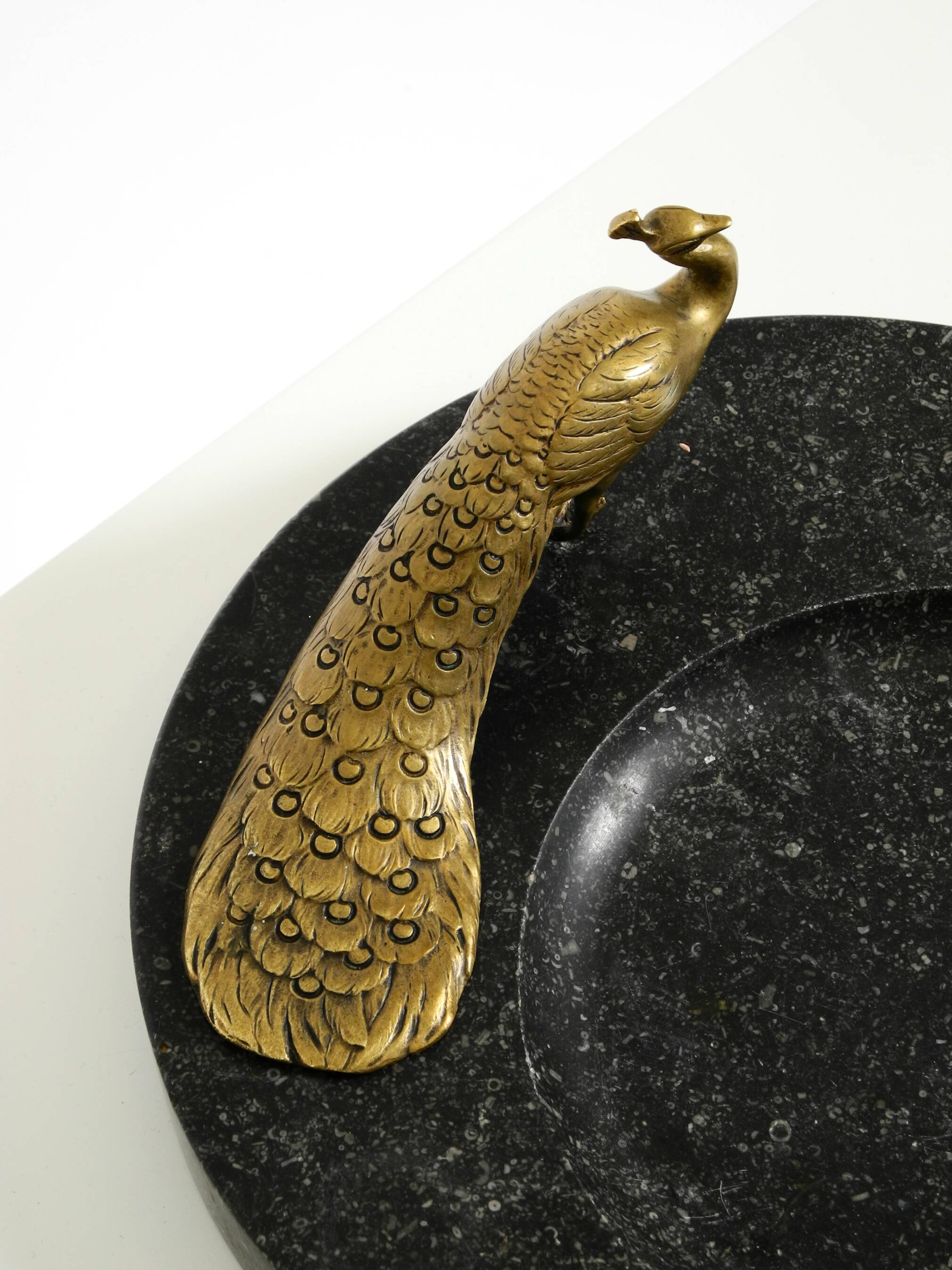 Beautiful, large black granite valet tray featuring a brass peacock, circa