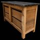 Old wooden workshop furniture with a stone top.