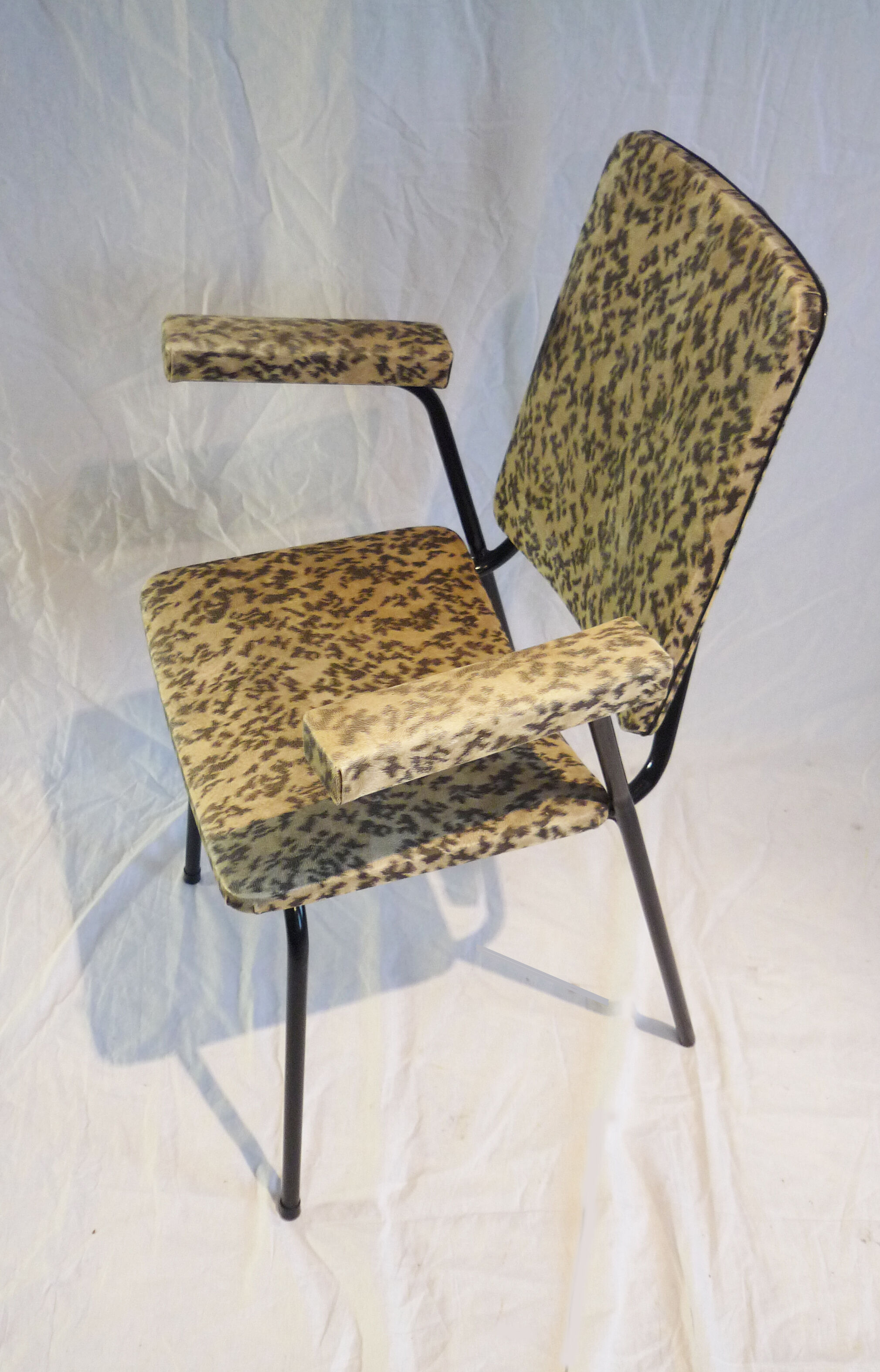 2 small black and white armchairs