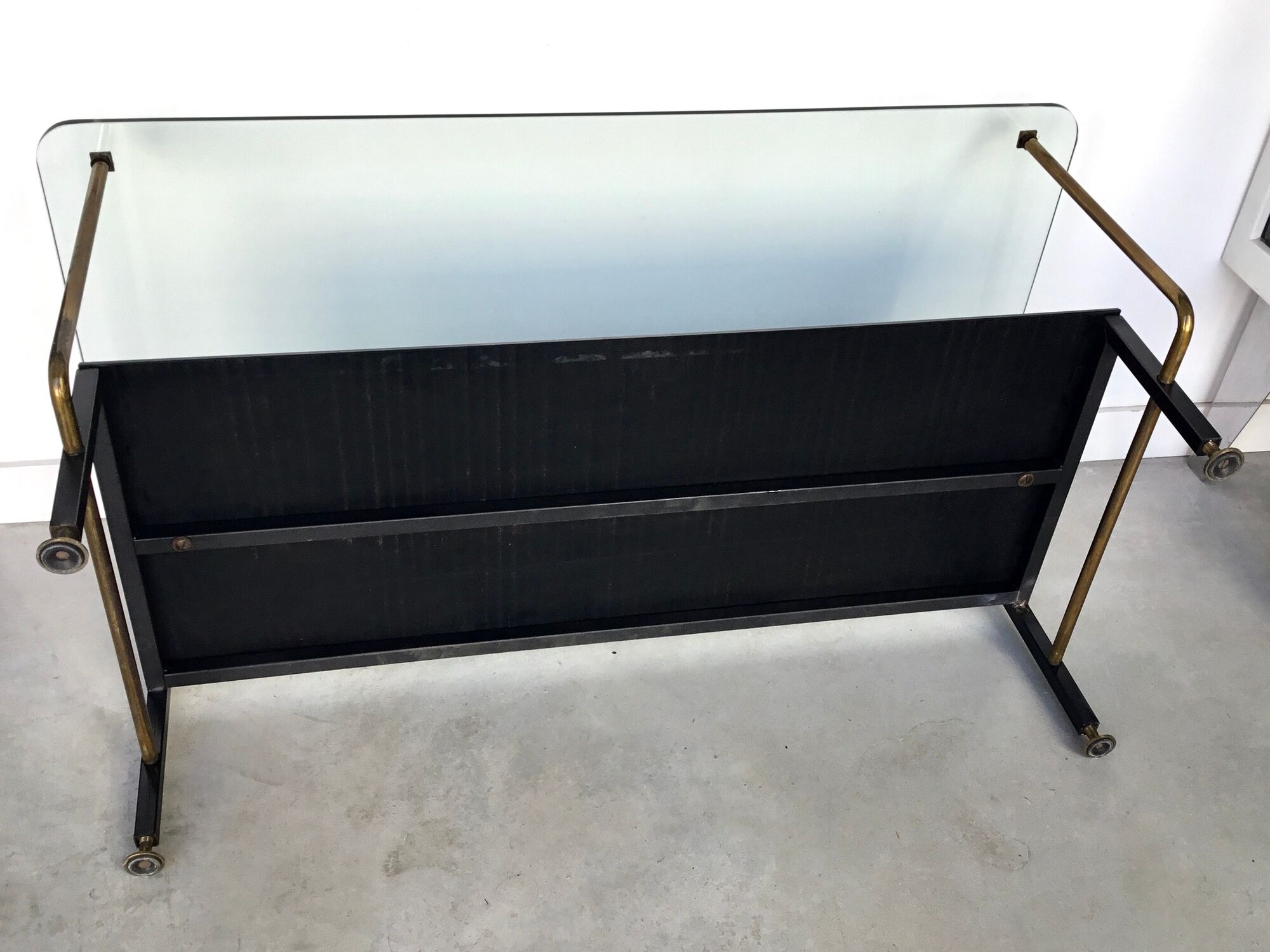 Modernist coffee table in metal tubular base and glass top 1950