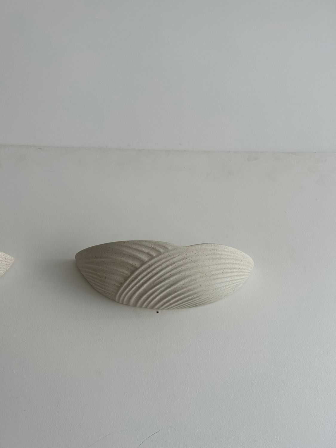 Pair of wall lamps in molded plaster France 1980