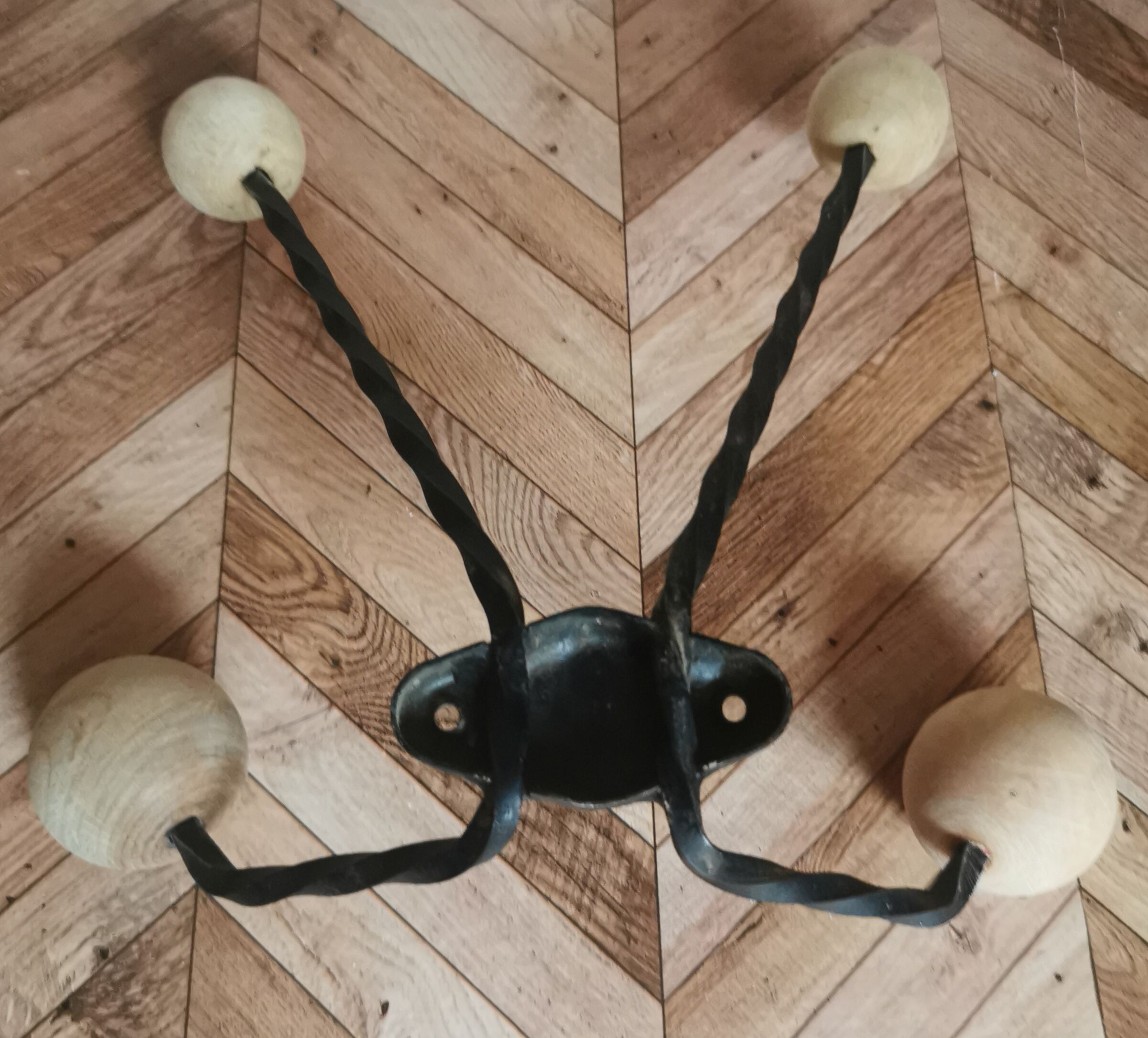 Wooden and iron wall coat holder