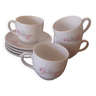 Set of white small cup and plates with floral design