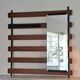 Vintage teak wall coat rack with 5 hooks and mirror.