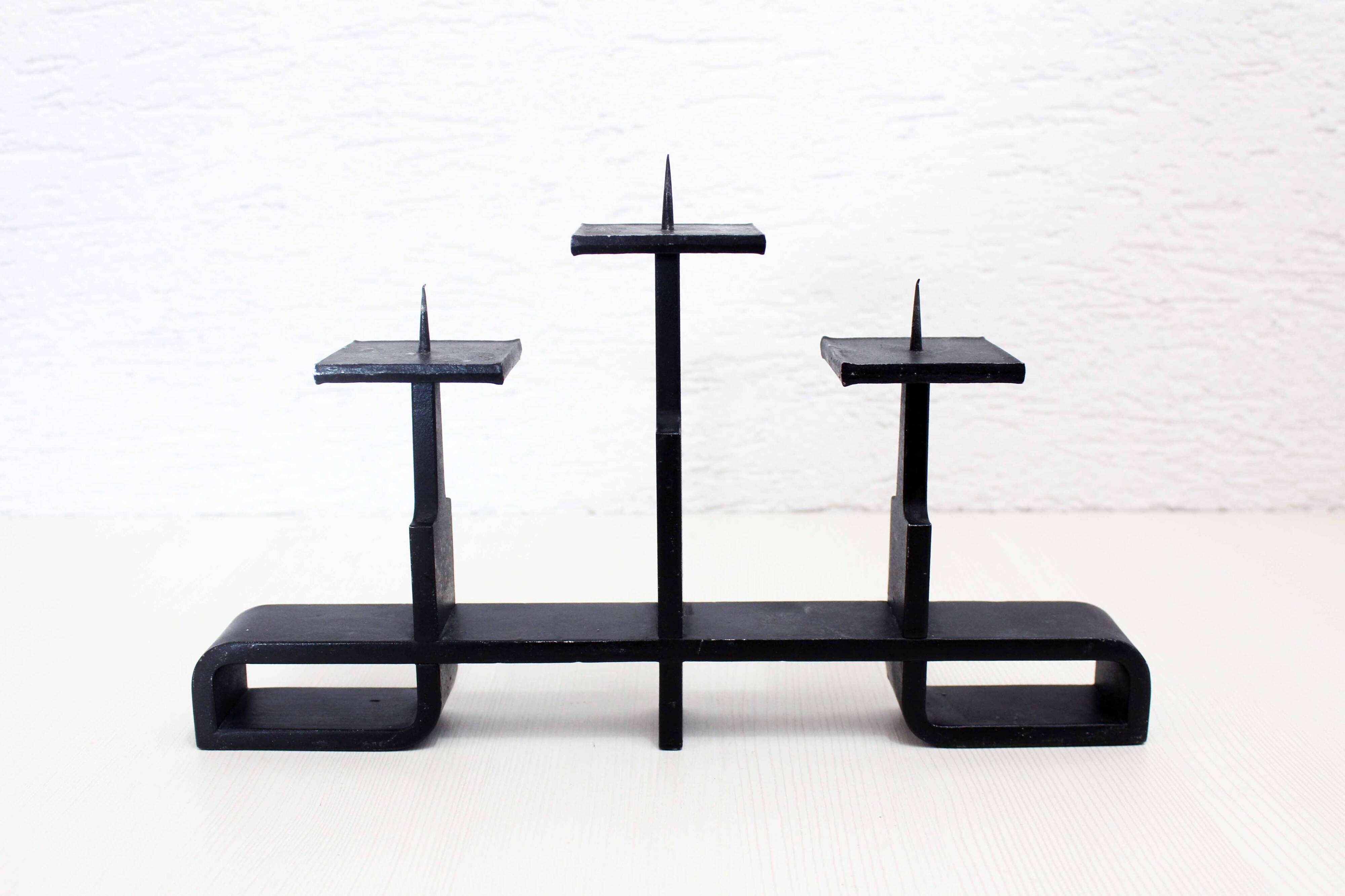 Modernist cast iron candle holder