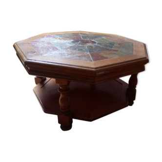 Octagonal wooden coffee table on stone