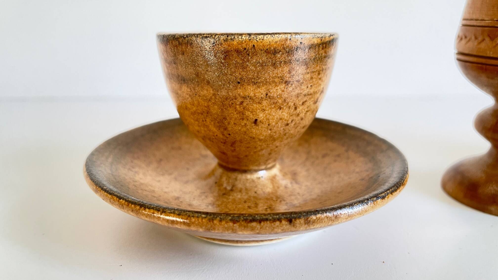 Trio of vintage ceramic and wood egg cups