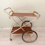 Rolling trolley in gold metal