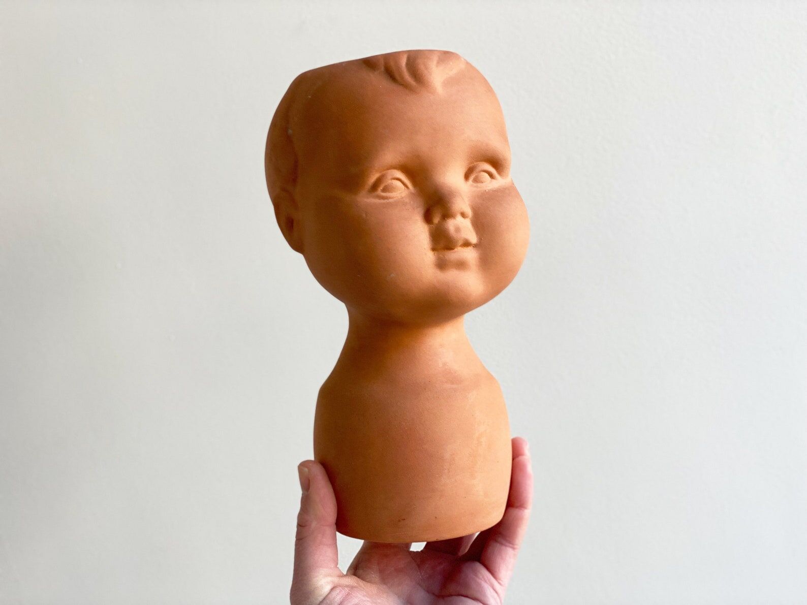 Vintage terracotta kids head vase