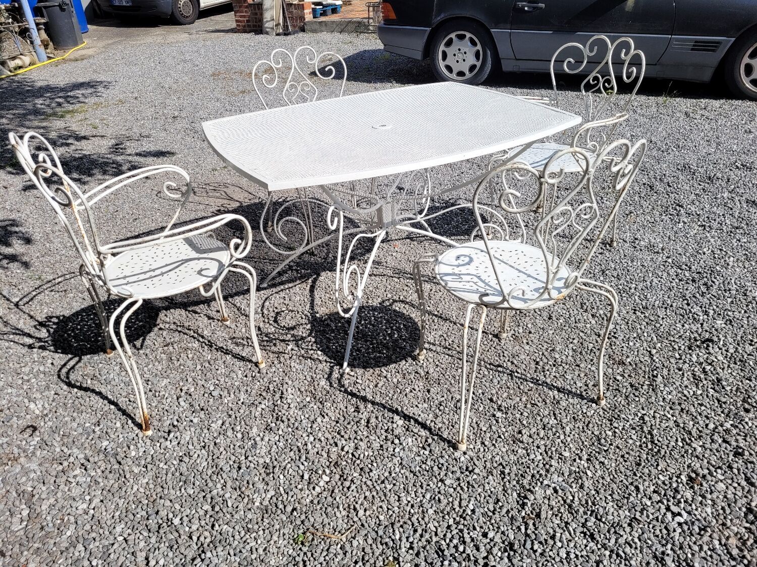Old wrought iron garden furniture, table + 2 armchairs + 2 chairs
