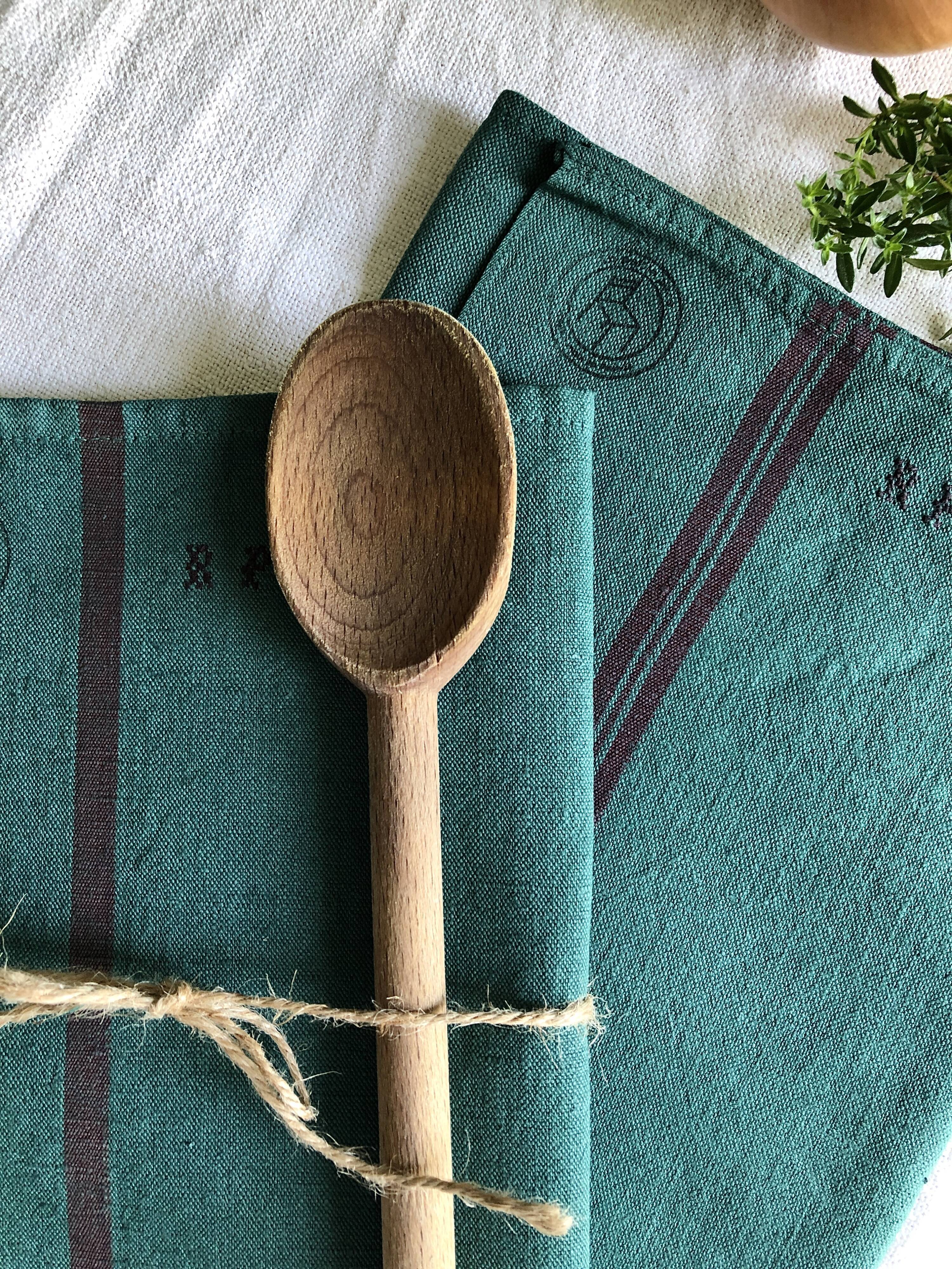 Old linen and cotton tea towel tinted in fir green