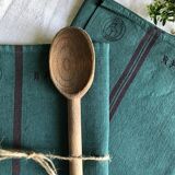 Old linen and cotton tea towel tinted in fir green