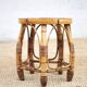 Vintage bamboo stool, woven rattan plant stand, interior decoration.