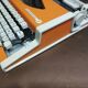 Olympia traveler de luxe orange typewriter serviced and new ribbon