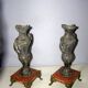 2 ancient amphorae in regulation on marble base