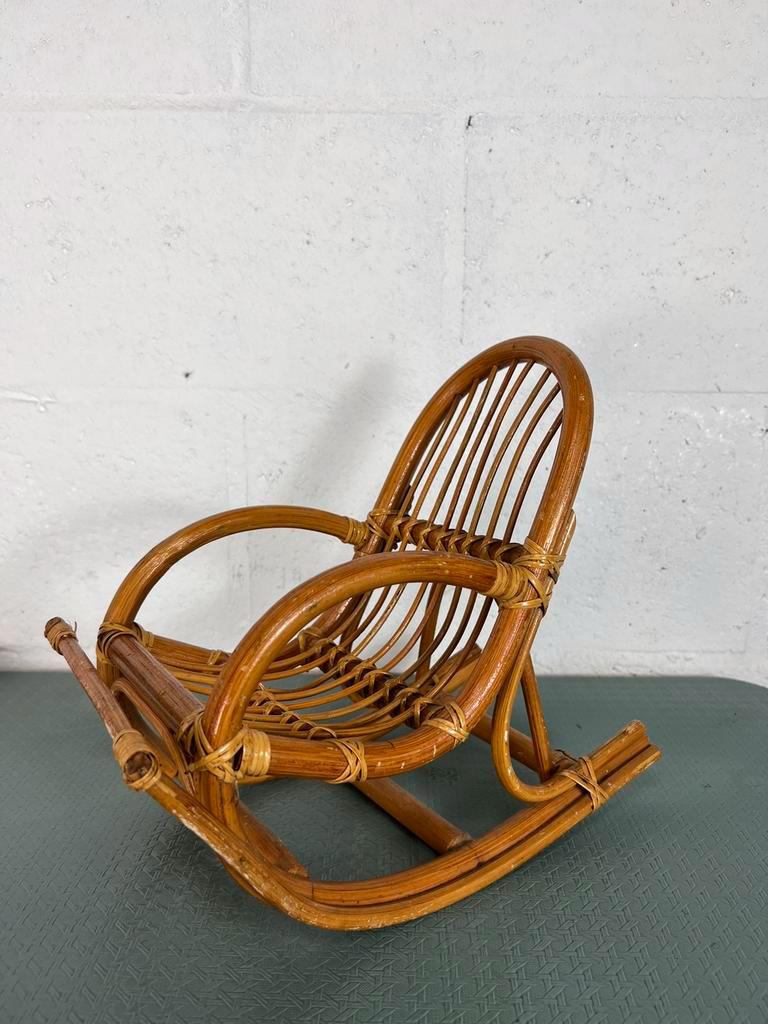 Vintage doll rocking chair in rattan