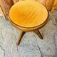 Adjustable vintage piano stool made of wood and velvet