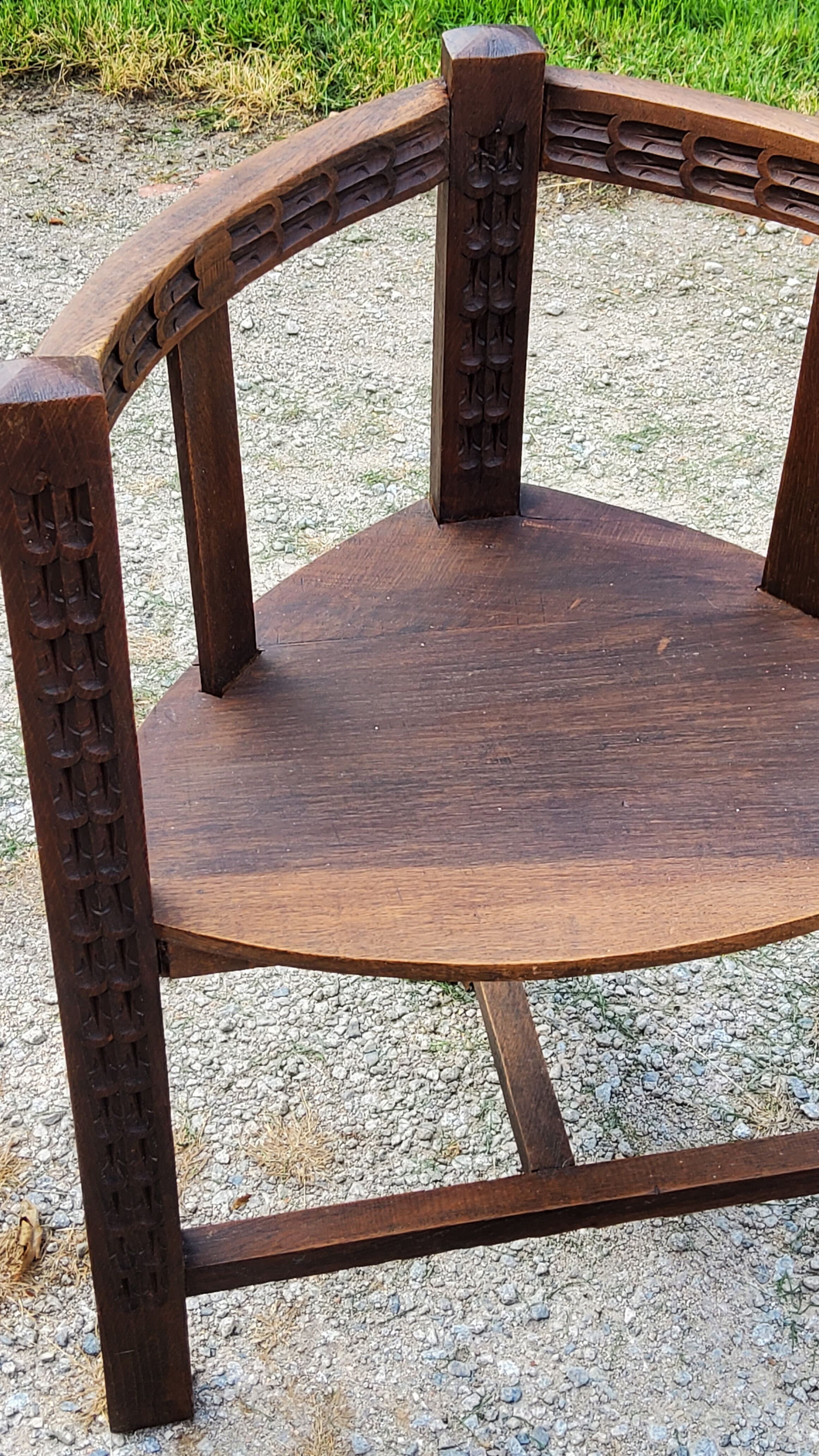 Set of three brutalist tripod armchairs in carved solid oak