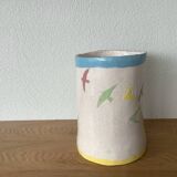 Signed pot with pastel swallows