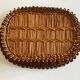 19th-century wicker basket embroidered by folk artisans.