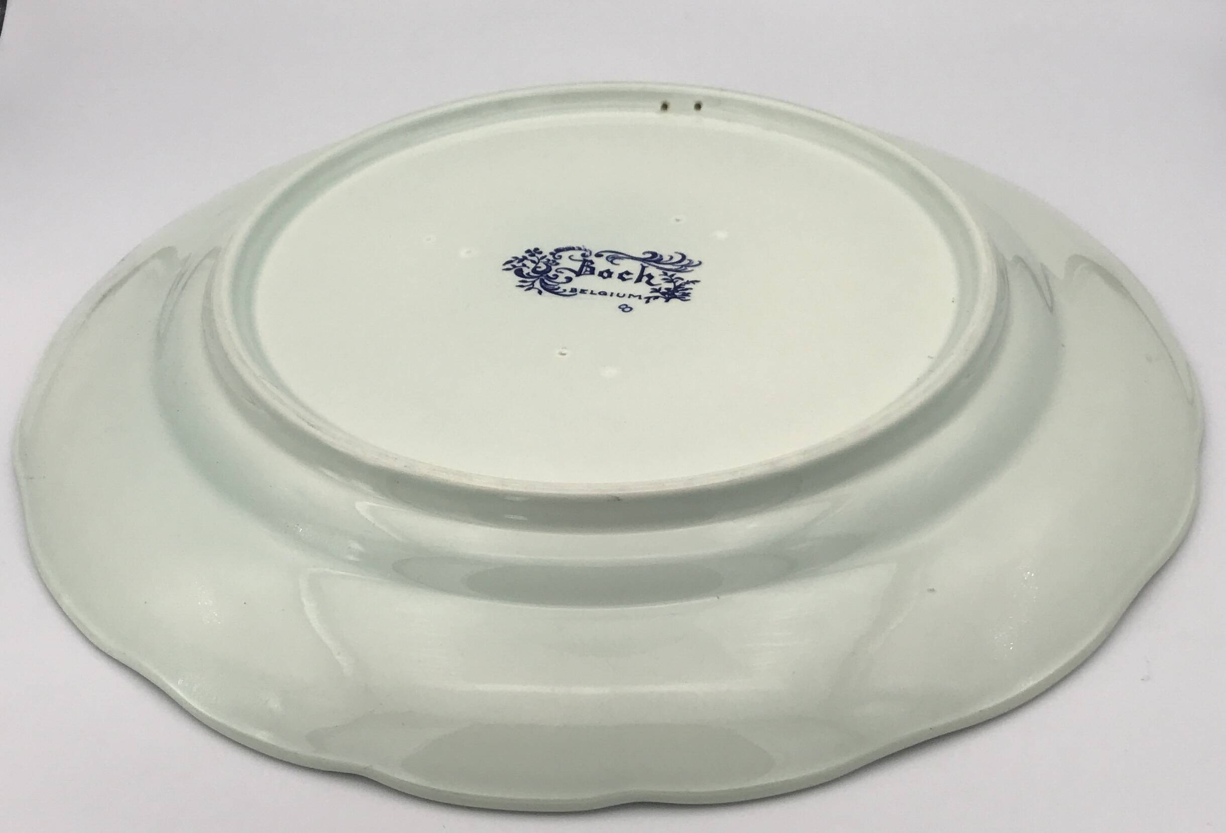 Blue enamelled earthenware wall dish with peasant scene decor Boch La Louvière