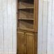 19th-century English corner cabinet in oak, mahogany, and fir.