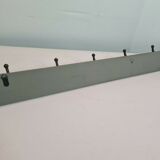 Wooden coat rack with cast iron hooks