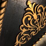 Black and gilded ebonite frame, wood and plaster 19th century