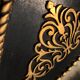 Black and gilded ebonite frame, wood and plaster 19th century