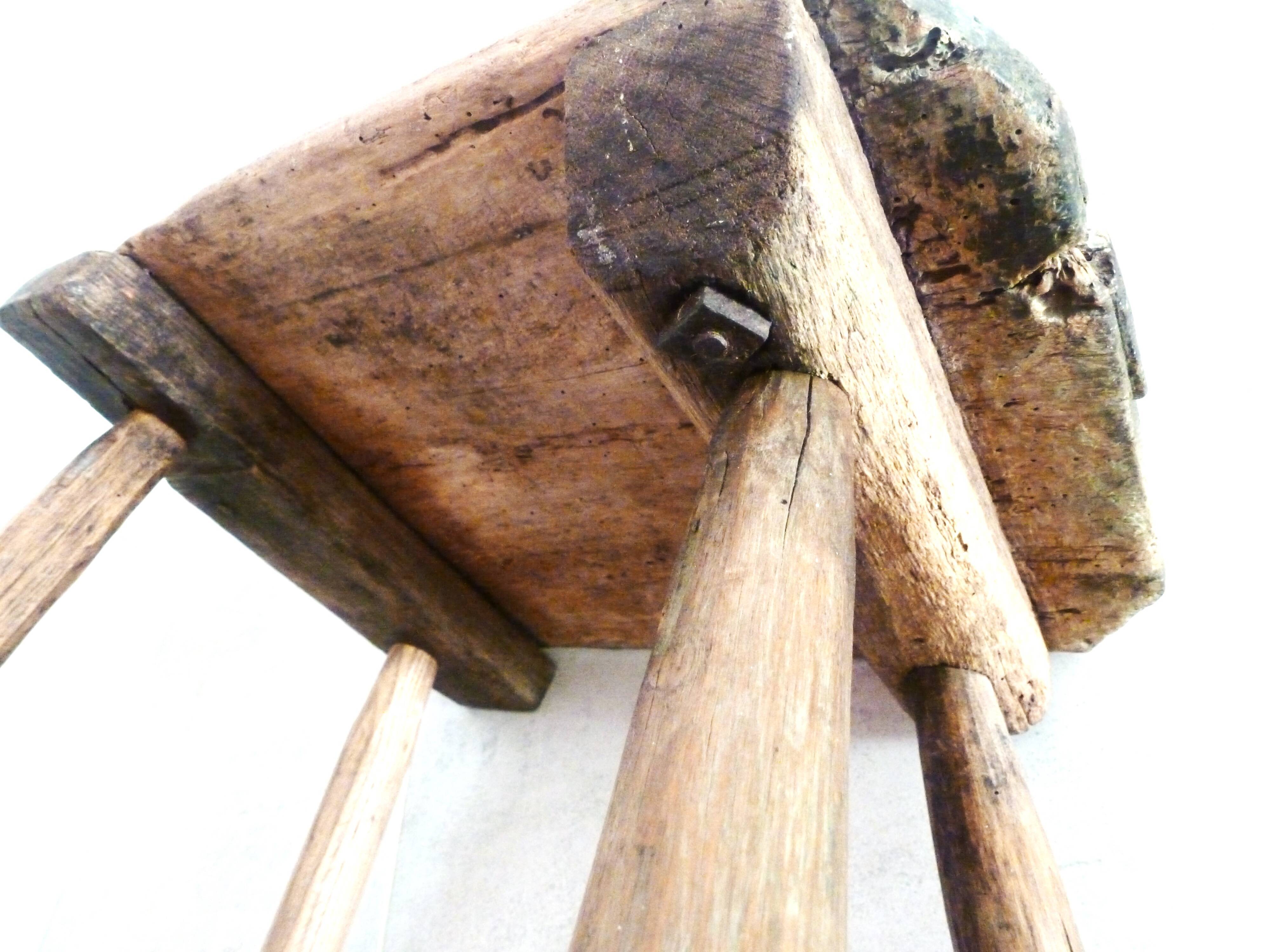 Old milking stool, old farm stool, primitive art.