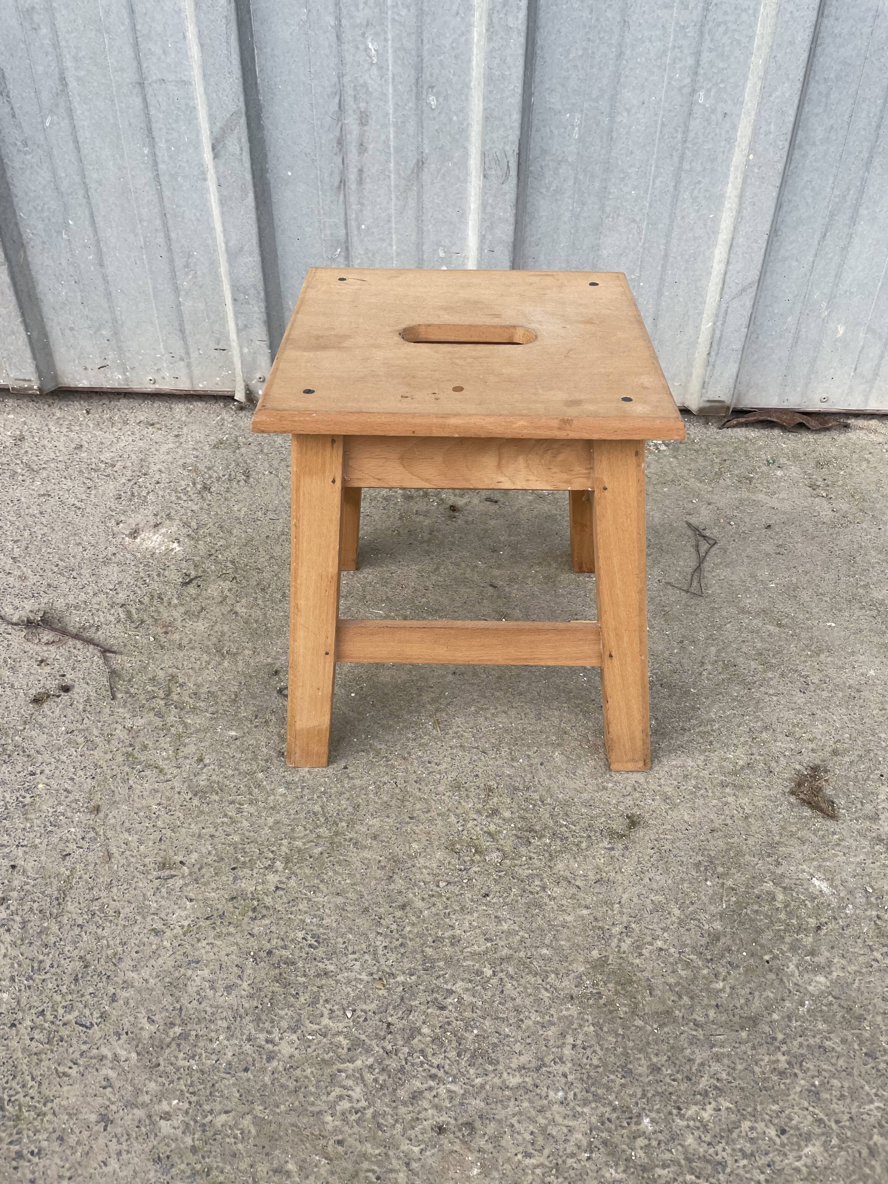 Small low wooden stool