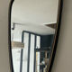 Asymmetrical free-form mirror from the 60s and 70s