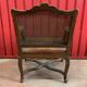 Fauteuil en noyer à fond de canne d'époque Régence début XVIIIème siècle