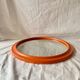 Vintage round wall mirror in orange painted wood - diameter: 48 cm