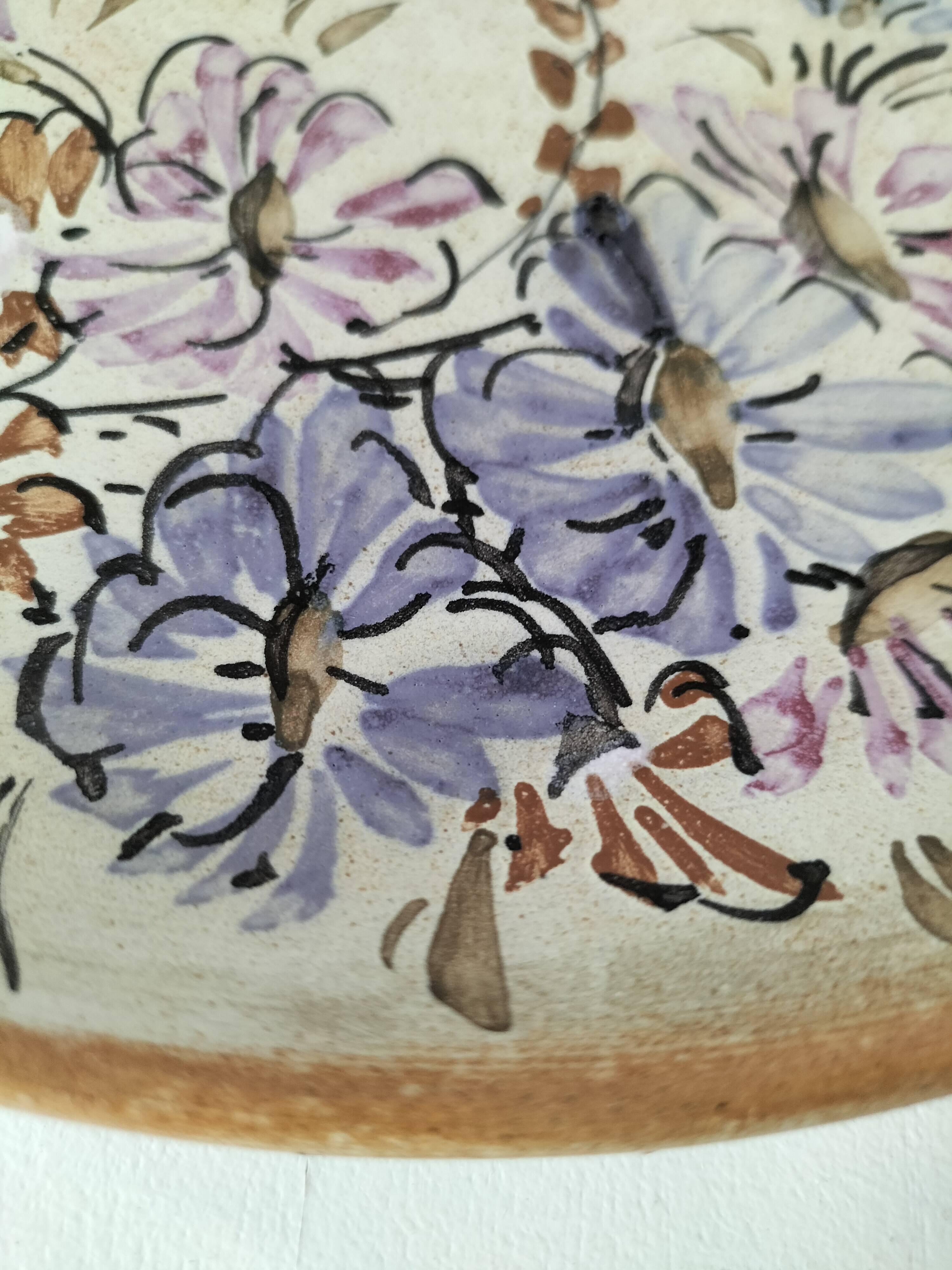 Stoneware plate with hand-painted floral decoration