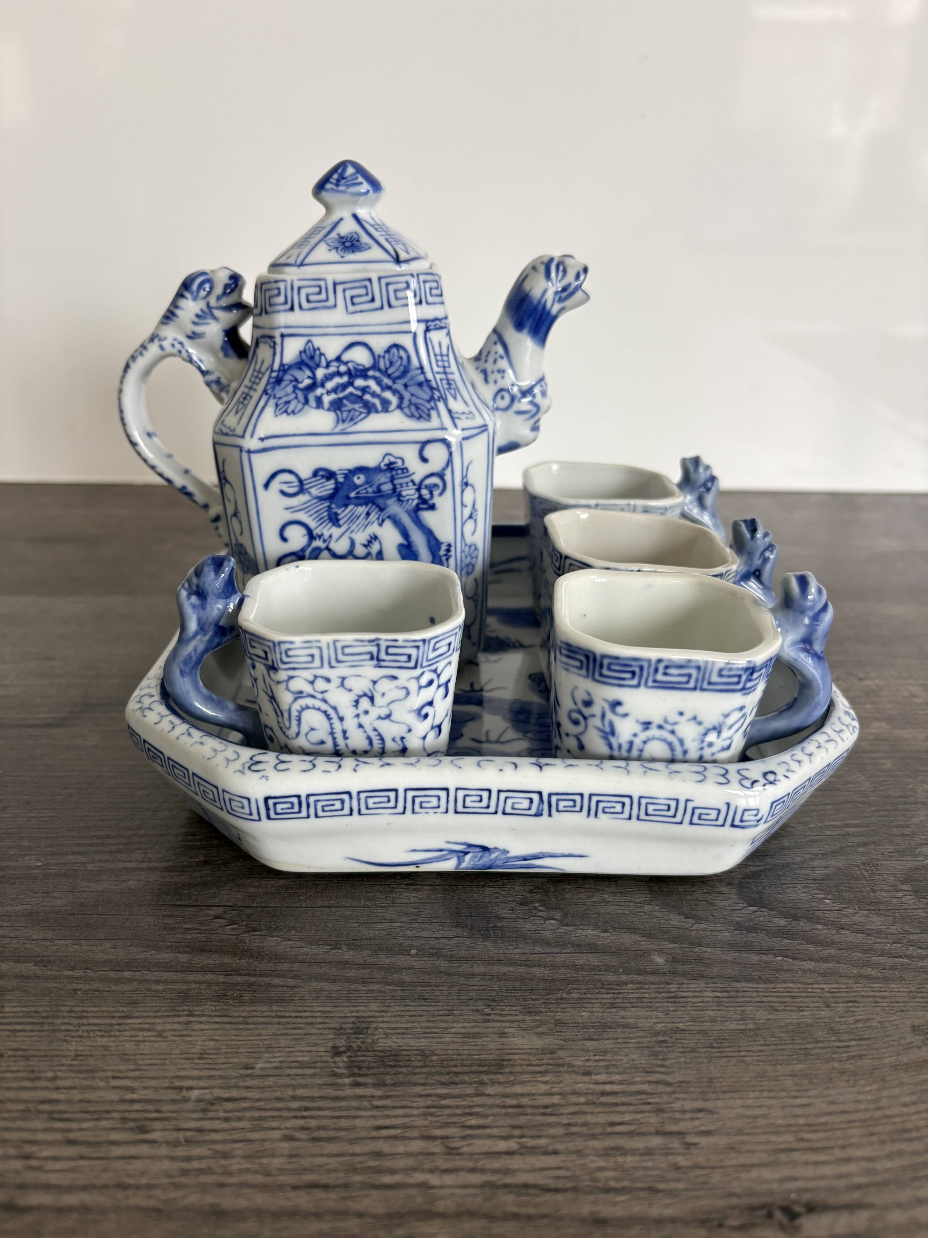 Antique Chinese tea set decorated with dragons.