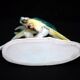 Earthenware figurine, a pair of German porcelain parrots