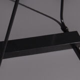 Floor lamp made from black painted metal with balancing arm