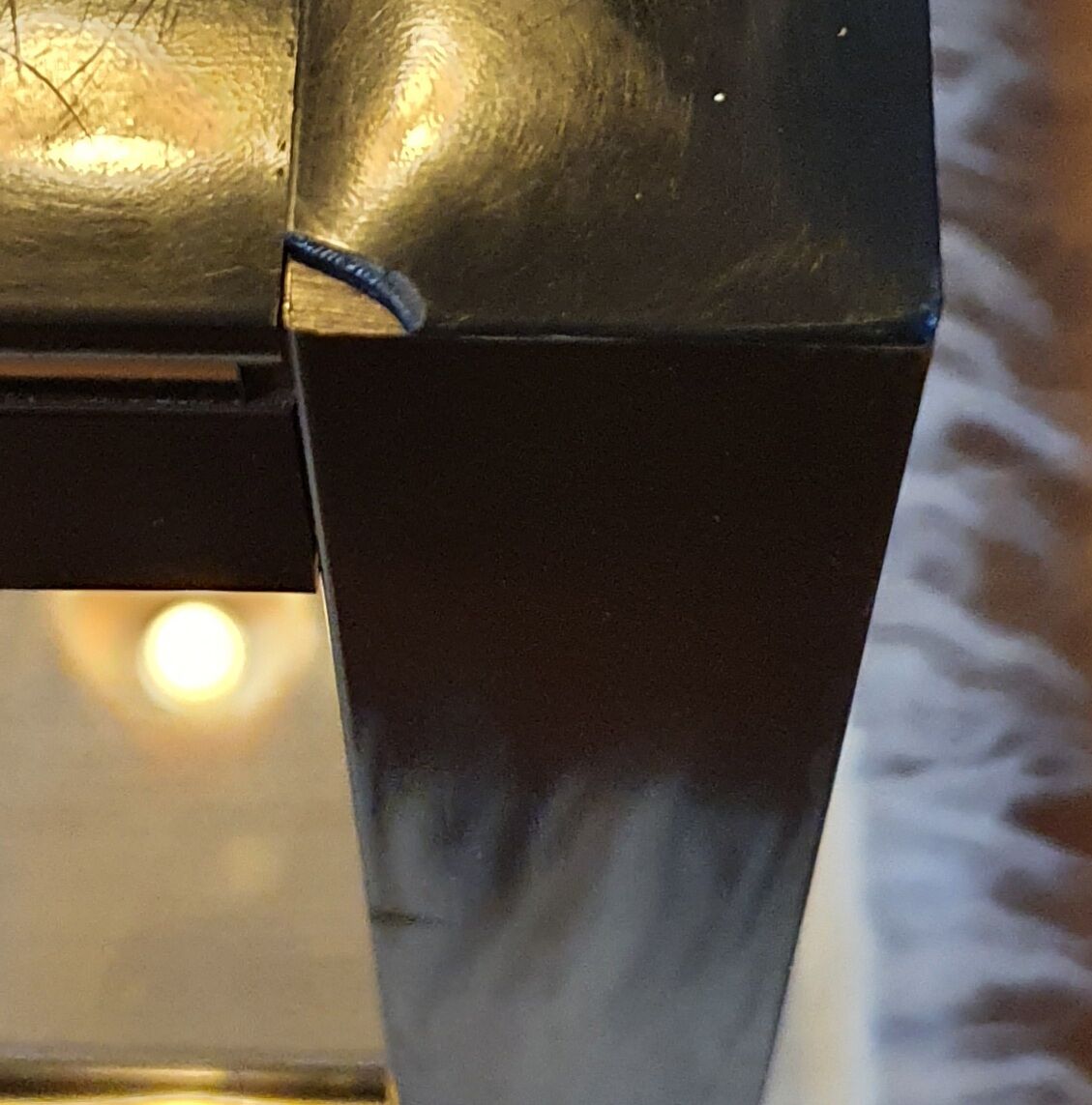 Black and gold coffee table with a double smoked glass top