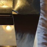 Black and gold coffee table with a double smoked glass top